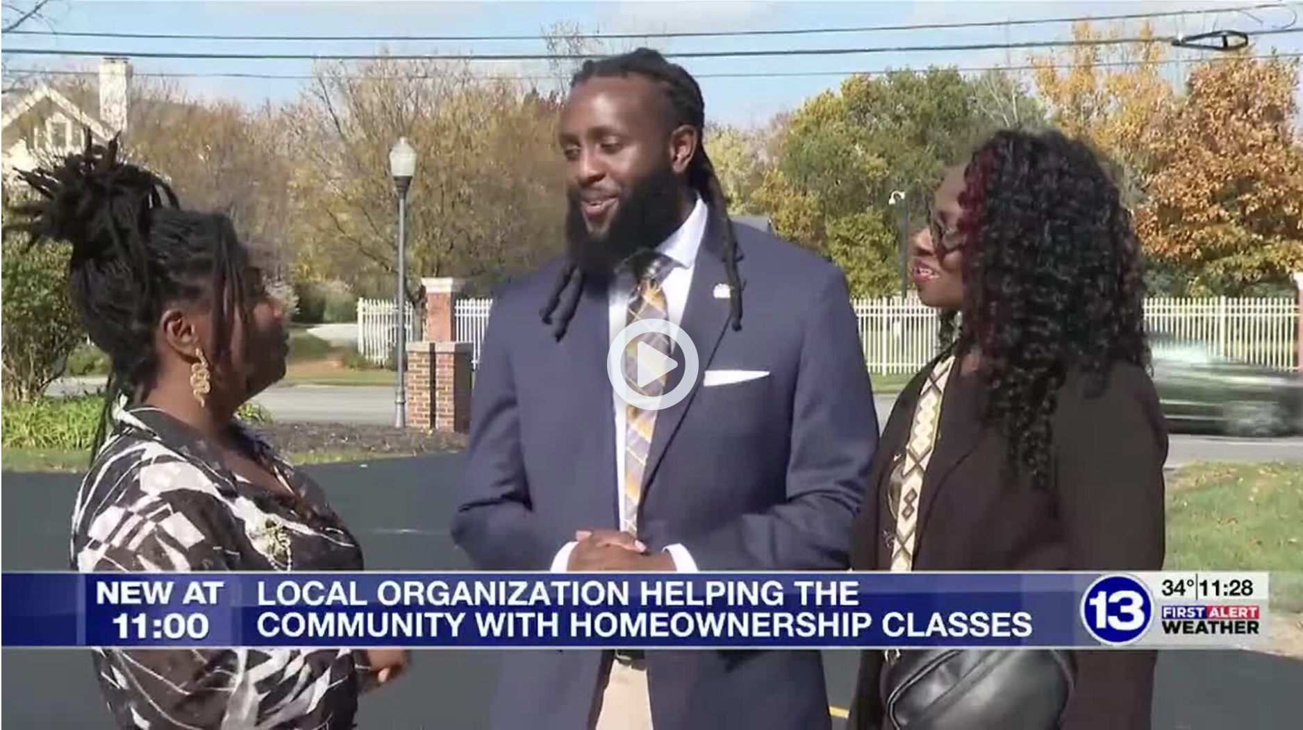 Rob Pasker speaks with community members during a 13ABC news segment highlighting free homeownership education classes in Toledo.